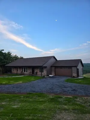 a large house with a large driveway at Just Like Home, Overlooks Maple Grove Raceway in Mohnton