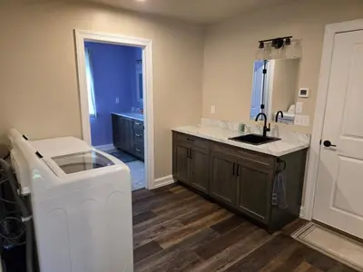 a kitchen with a sink and a counter top at Just Like Home, Overlooks Maple Grove Raceway in Mohnton