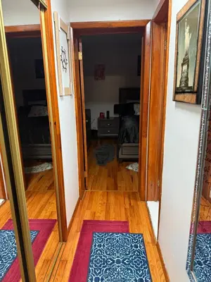 a hallway with a door open to a room at Private Room 15 Mins to Times Square NYC in West New York