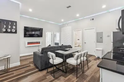 a living room with a couch and a table and chairs at Stay at Luna on 16th & Ridge Ave in Philadelphia