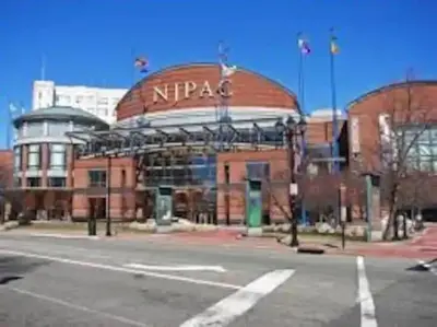 a large brick building with a sign on it at New Calm Cocoon by Train We Pay Half Parking, Sleeps 6 in Hoboken