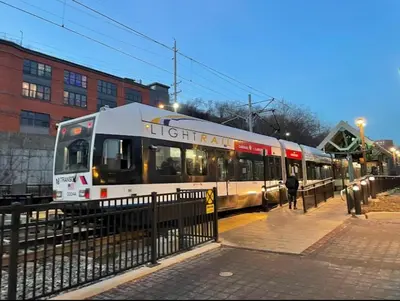 a train on the tracks in a city at New Calm Cocoon by Train We Pay Half Parking, Sleeps 6 in Hoboken