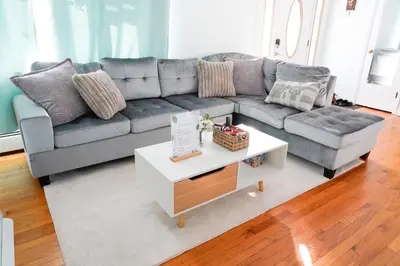 a living room with a couch and a coffee table at Family River Valley Retreat with Fireplace in Sparrow Bush