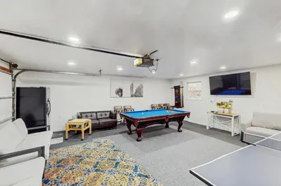 a living room with a pool table in it at Lakeside Escape in Blakeslee