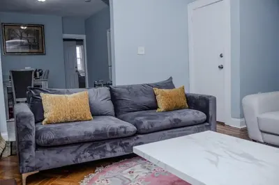 a living room with a couch and a coffee table at Heavenly Retreat Luxury 3 Bedrooms 1 Bathroom in East Orange