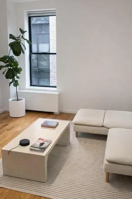 a living room with a couch and a coffee table at Elegant NYC Apartment with Designer Touches in New York