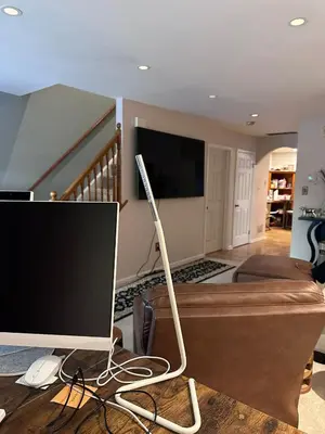 a computer monitor on a table in a living room at Home Away From Home in Ridley Park