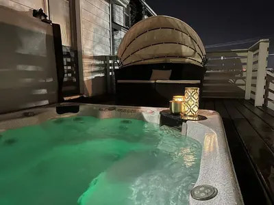 a hot tub on a deck with a boat at Best RV-Camper To Visit NYC-Hot Tub-Free Parking in Hillside
