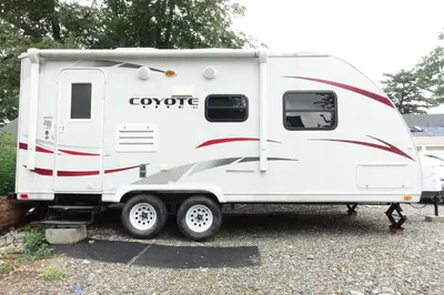 a white trailer parked in a parking lot at Best RV-Camper To Visit NYC-Hot Tub-Free Parking in Hillside