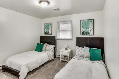 a bedroom with two beds and a window at Family Home on Greenbelt, 4 Mi to Dtwn Harrisburg! in Harrisburg