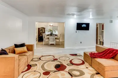 a living room with a couch and a table at Family Home on Greenbelt, 4 Mi to Dtwn Harrisburg! in Harrisburg
