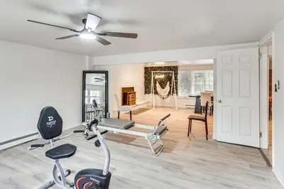 a living room with a gym with exercise equipment at Family Home on Greenbelt, 4 Mi to Dtwn Harrisburg! in Harrisburg