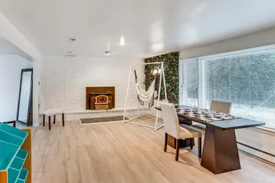 a living room with a table and chairs and a fireplace at Family Home on Greenbelt, 4 Mi to Dtwn Harrisburg! in Harrisburg