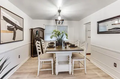a dining room with a table and chairs at Family Home on Greenbelt, 4 Mi to Dtwn Harrisburg! in Harrisburg