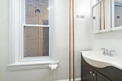 a bathroom with a sink and a window at The Serenity Manor in Chester