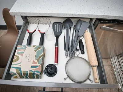 a drawer filled with kitchen utensils on a counter at Excellent Location-20 Minutes to NYC-Free Parking in West New York
