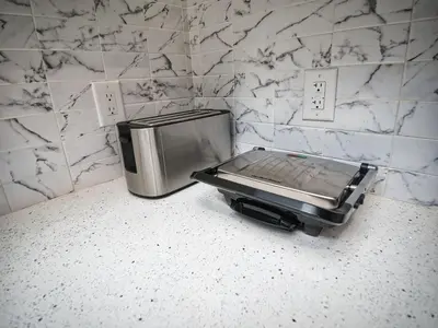 a toaster sitting on a counter next to a toaster at Excellent Location-20 Minutes to NYC-Free Parking in West New York