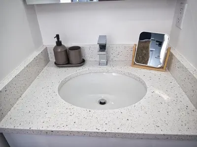 a bathroom counter with a sink with a counter top at Excellent Location-20 Minutes to NYC-Free Parking in West New York