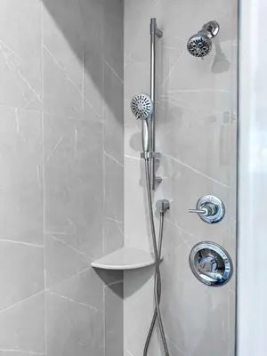 a shower with a shower head in a bathroom at City excitement -Studio 20 Minutes to (42st) NYC in West New York