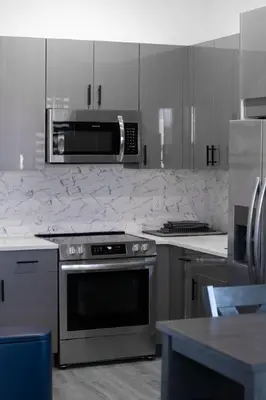 a kitchen with a stove and a microwave at Stylish Studio Apt-Outside NYC in West New York