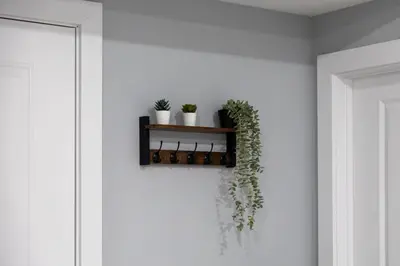 a shelf with potted plants on a wall at Quick NYC Access with Free Parking Two Bedrooms Near NYC in West New York