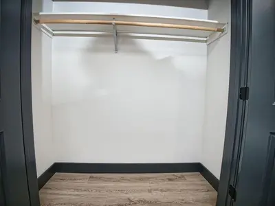 a room with a closet with a white wall at Explore New York City-20 Minutes Away With Parking in West New York