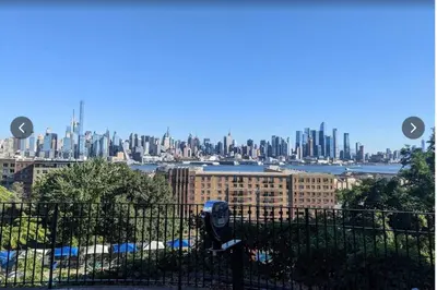 a view of a city skyline with a parking meter at Great Location-20 Mins to NYC-Free Indoor Parking in West New York