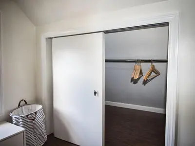a door to a kitchen with utensils hanging from it at Comfy 3rd Floor Studio Near NYC in Ridgefield Park