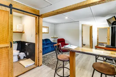 a room with a table and chairs and a room with a bathroom at Deluxe Cabin D at Elk Creek Escape! Pets Welcome in Hillsgrove