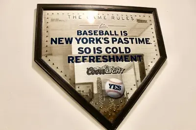a framed picture of a baseball sign on a wall at Private room B in West NYNJ 12mints from NYCity Times Square in West New York