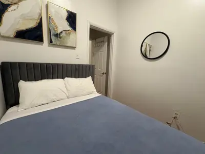 a bedroom with a bed and a mirror on the wall at The Midtown Ninth Manhattan Times Square in New York