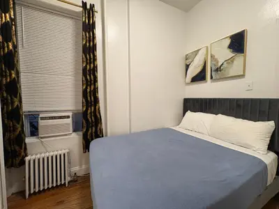 a bedroom with a bed and a window at The Midtown Ninth Manhattan Times Square in New York