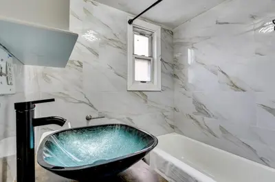a bathroom with a sink and a tub at Walk to Public Transit! Pet-Friendly Lodi Apt in Lodi