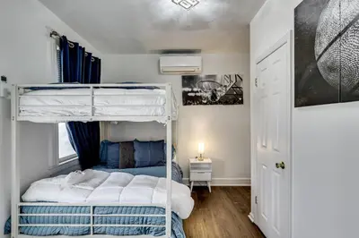 a bedroom with a bunk bed with blue and white at Walk to Public Transit! Pet-Friendly Lodi Apt in Lodi