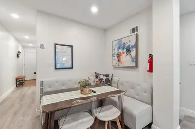 a living room with a table and a couch at Holiday Home Brownstone City Stay 5BEDS, Private Dual Units in Jersey City