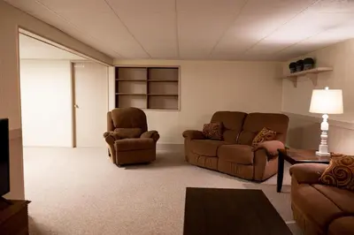 a living room with two chairs and a couch at Cozy Home In The Middle Of Amish Country in Ronks