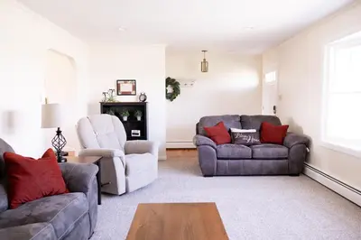 a living room with two couches and a table at Cozy Home In The Middle Of Amish Country in Ronks