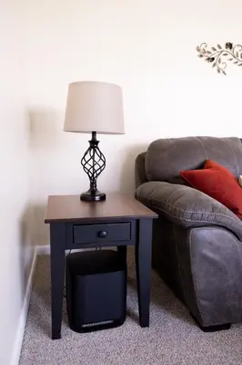 a table with a lamp on it next to a couch at Cozy Home In The Middle Of Amish Country in Ronks