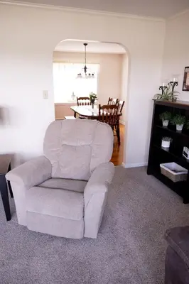 a living room with a chair and a table at Cozy Home In The Middle Of Amish Country in Ronks