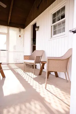 two chairs and a table on a porch at Cozy Home In The Middle Of Amish Country in Ronks