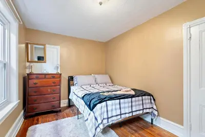 a bedroom with a bed and a dresser and a window at Moonbeam Suite-Private Room in Serenity Manor in Chester