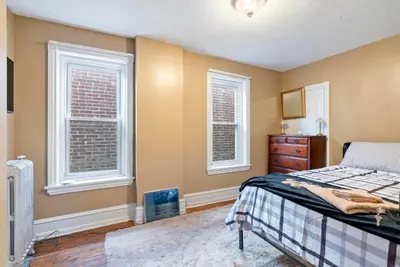 a bedroom with a bed and two windows at Moonbeam Suite-Private Room in Serenity Manor in Chester