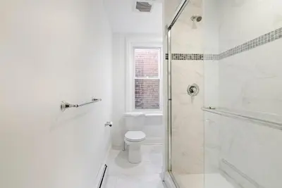 a white bathroom with a toilet and a shower at Moonbeam Suite-Private Room in Serenity Manor in Chester