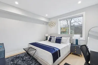 a white bedroom with a bed and a window at Luxe Oasis with Gym - Near Stadium & Hospital with Rooftop in Philadelphia