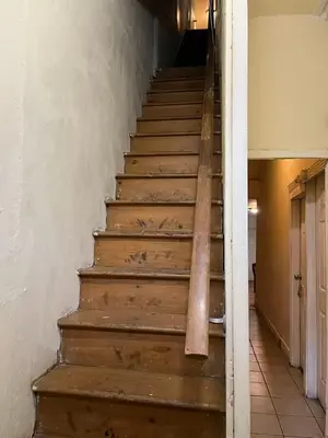 a staircase in an old building with wooden steps at 2131 Double Room F in Philadelphia