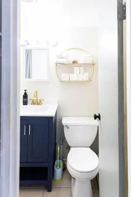 a bathroom with a white toilet and a sink at Cozy and Convenient Studio with 3 beds 10 Minutes to NYC in Union City
