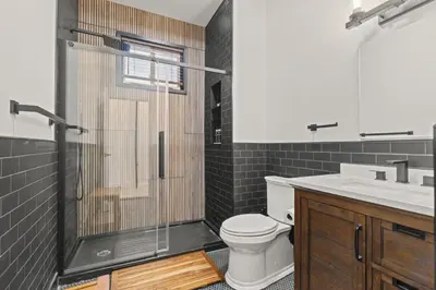 a bathroom with a shower and a toilet and a sink at City Living without Compromise Full-Size 1BR in Philadelphia