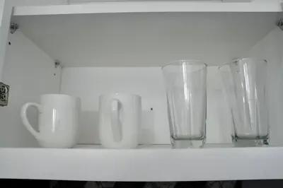 a shelf with three vases and cups on it at Prime Oasis,1 mi to Temple U,Washer and Dryer,Free Snacks in Philadelphia