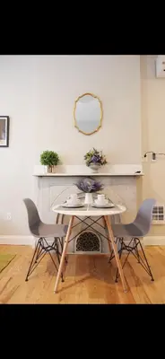 a table with two chairs and a table with a mirror at Bright Private Apartment in University city near Drexel&UPenn in Philadelphia