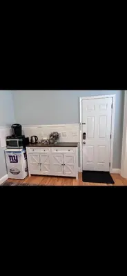 a kitchen with a white door and a stove at Bright Private Apartment in University city near Drexel&UPenn in Philadelphia